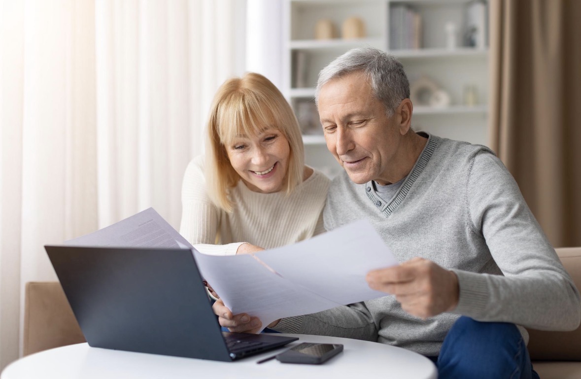 A couple reading documents together at home